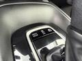 Close-up of the gear shifter area in a 2025 Toyota Corolla featuring buttons for drive modes including drive off and EV mode