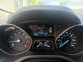 Dashboard of a 2014 Ford Escape showing speedometer fuel gauge and trip information display
