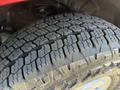 Close-up of a tire tread pattern showing deep grooves and various shapes designed for traction on a 2018 GMC Canyon