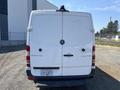 A white 2016 Mercedes-Benz Sprinter van viewed from the rear with the brand logo visible and license plate attached