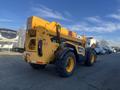 A 2013 JCB 510-56 Loadall with yellow exterior and large tires is positioned in a parking area showcasing its telescopic boom and rear view