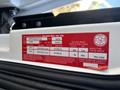 A red label displaying specifications and details for a 2022 Lion Lion6 including tire sizes and vehicle weight information