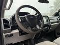 Interior view of a 2020 Ford F-550 featuring a steering wheel and dashboard with various controls and displays