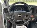 Interior of a 2020 Chevrolet Express showing the steering wheel dashboard with gauges and control buttons