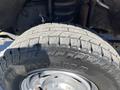 Close-up of a Yokohama tire mounted on a rim from a 2016 Ford F-250 SD showcasing tread pattern and detail of the tire sidewall