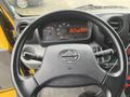 Interior view of a 2019 Hino 155 truck featuring a steering wheel and dashboard displaying various gauges and controls