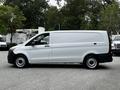 A 2020 Mercedes-Benz Metris van in white with a sliding side door and black wheels viewed from the side