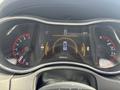 Instrument cluster of a 2015 Dodge Durango showing speedometer, fuel gauge, and digital display indicating range and temperature