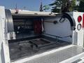A 2017 Chevrolet Colorado with an open bed showing a mounted reel and equipment storage compartments