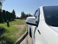 A white 2017 Chevrolet Colorado with a distinctive side mirror and a noticeable profile view