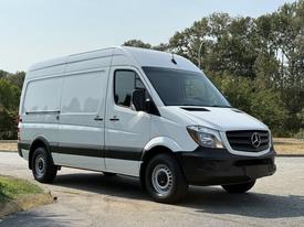 White 2017 Mercedes-Benz Sprinter van with black accents and a high roof