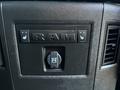 Close-up of the dashboard controls in a 2018 RAM 3500 featuring heated seat buttons and a 12V DC outlet