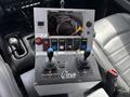 Control panel with buttons and joystick designed for operating equipment in a RAM 5500 vehicle