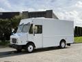 A white 2017 Freightliner MT45 delivery truck with a boxy shape and large windshield parked on a concrete surface