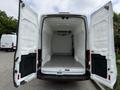 A 2017 Ford Transit van with open double rear doors showing an empty, insulated cargo area with a smooth floor