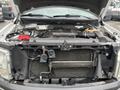 Engine compartment of a 2013 Ford F-150 showcasing the exposed engine components and various mechanical parts without any covers or exterior elements visible