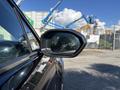 A side mirror of a 2023 Fisker Ocean showcasing its modern design and sleek lines