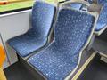 Two blue bus seats with a geometric pattern in a 2016 Grande West Vicinity bus interior