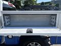 A 2017 Chevrolet Colorado with an open truck bed toolbox showing the interior space and mounting points visible inside