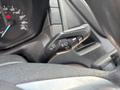 Close-up of a Ford Transit-350 control stalk featuring buttons for vehicle functions such as windshield wipers and turn signals