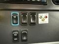 Interior dashboard of a 2016 Freightliner 108SD featuring various switches and indicator lights including a light test button and an alarm signal