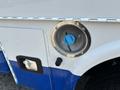 Close-up of a blue fuel cap on a 2017 Chevrolet Colorado revealing a circular opening secured by a metal ring