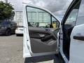 2021 Ford Transit Connect with the driver's side door open showing the interior door panel and window controls