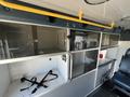Interior view of a 2013 Chevrolet Express featuring shelving units and storage compartments in a van-like layout