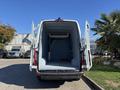 A 2021 Mercedes-Benz Sprinter 2500 with open rear doors revealing a spacious cargo area lined with light blue material