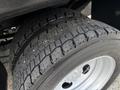 Close-up of a tire on a 2017 Ford F-550 showing a rugged tread pattern designed for traction and stability