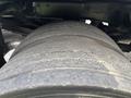 Close-up of a worn tire on a 2013 RAM 5500 showcasing visible grooves and tread pattern indicating usage and wear