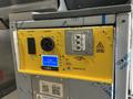 2023 Ford Transit with a yellow battery system panel featuring power outlets an LCD display and safety indicators