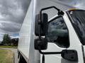 A white 2022 International MV607 truck with a large cargo box and prominent side mirrors