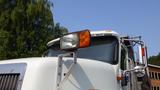 A 2003 International 5600i truck with a prominent front grille and large headlights including a turn signal light on top
