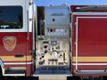 Close-up of the control panel of a 2004 American LaFrance Eagle fire truck featuring various gauges knobs and controls for operation