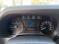 Dashboard display of a 2023 Ford E-450 showing speedometer fuel gauge and other readings