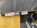 Close-up of a 2010 Vermeer Corporation BC1200XL with warning labels and a marked diesel indicator on a black and yellow surface