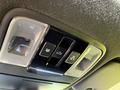 Control panel with buttons for lights and vehicle features in a 2024 Kia Forte5