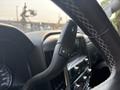 Interior view of a 2017 Chevrolet Silverado 1500 showing the steering wheel with a mounted control stalk featuring plus and minus symbols