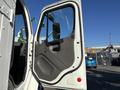 2005 Freightliner M2 106 truck door open showing interior handle and window with a clear view of the driver's side mirror