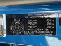 A blue 2021 Kia Forte vehicle identification plate showing weight specifications and manufacturing details