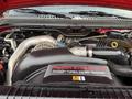 Engine compartment of a 2007 Ford F-550 showcasing a Power Stroke V8 turbo diesel engine with various components and piping visible