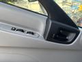 Close-up of the interior door panel of a 2018 Hino 195 featuring window controls and a door handle