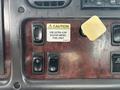 Control panel of a 2010 Freightliner M2 106 featuring switches for various functions and a caution label about using ultra low sulfur diesel fuel only