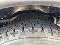 Close-up of a tire on a 2020 Chevrolet Express showcasing the tread pattern and sidewall details