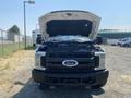 A 2017 Ford F-250 SD with the hood open displaying the engine compartment
