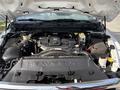 View of the engine compartment of a 2013 RAM 5500 showing the heavy-duty engine components and various fluids and hoses