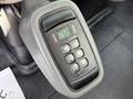 A close-up of a gear shift control panel for a 2011 International 7500 with buttons for various settings including drive neutral and reverse