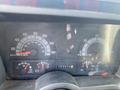 Dashboard of a 1996 GMC Top Kick displaying speedometer fuel gauge and engine RPM with various indicator lights and readings