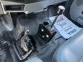 Interior view of a 2017 Ford F-650 Super Duty featuring a gear shifter and a mechanical lever on the floor console
